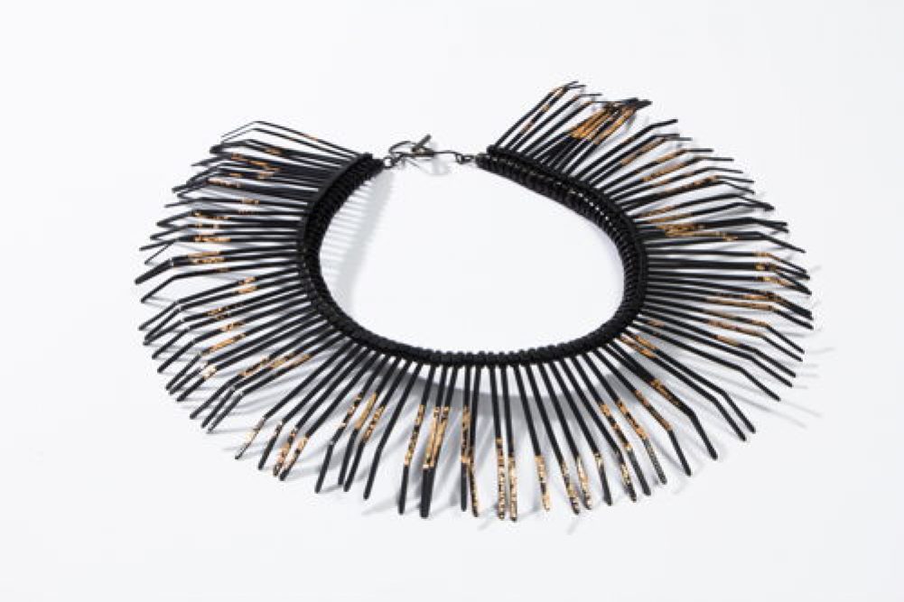 Black plastic seal necklace with gold foil