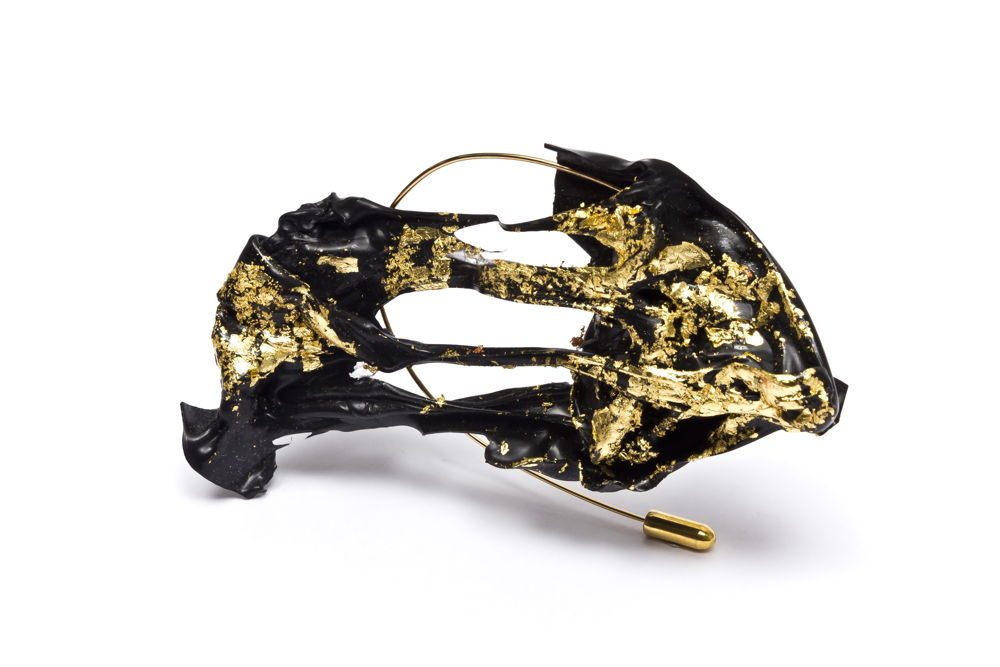 Plastic thermoformed black brooch with gold leaf
